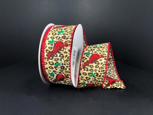 The Cheetah Satin/Red Cardinal 1.5X10Y Ribbon (72107-09-12) features a synthetic wired edge, leopard print background, red cardinals, and green leaves on a dark satin base with red edging. Partially unrolled for display.