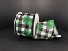 A partially unrolled 2.5x10Y ribbon, named Black-White Buffalo Plaid Linen/Pine Needles, displays a buffalo plaid pattern with green pine branches against a dark background.
