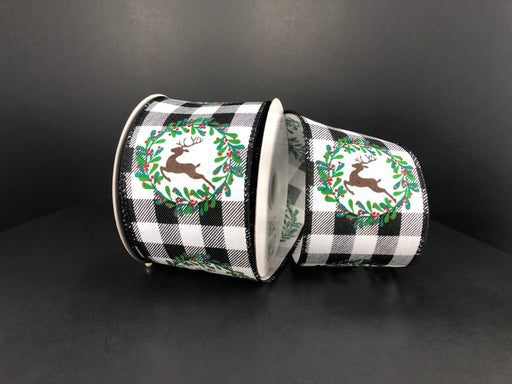Two rolls of 2.5 Black-White Buffalo Plaid/Deer Wreath ribbon, with holiday designs featuring reindeer and wreaths accented in green and red on a black background.