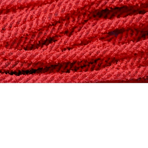 Close-up of intertwined red pipe cleaners on a white background, resembling the fuzzy, fibrous texture of Deco Flex Tubing Red Snowdrift RE322424. The vibrant red color and visible strands make it perfect for holiday creations.