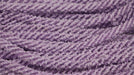 Close-up of 8Mm X 20Yd Snowdrift Deco Flex Tubing in Orchid (RE322495), with multiple twisted cords arranged in wavy, parallel rows for a repetitive pattern.