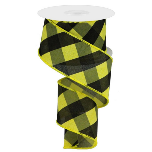The 2.5 Yellow Black Grey Bold Check Ribbon RGA112929 features a yellow, black, and grey buffalo plaid pattern with one side unwinding in a spiral. Made from durable polyester, it offers a striking geometric design for lasting quality.