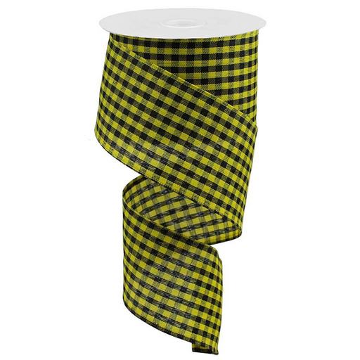 The 2.5 Yellow Black Gingham Check Ribbon RGA121257 spirals down in a yellow and black pattern, neatly wound around a white cylindrical holder, showcasing its textured fabric design.
