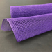 Against a plain black background, two vibrant rolls of 10 Purple Fabric Mesh XB97910-11 highlight their textured, grid-like pattern.