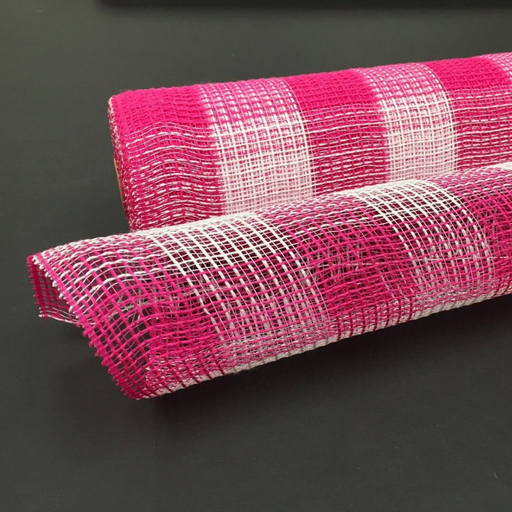 A roll of 10 Fuchsia White Plaid Fabric Mesh XB99010-28 lies on a black surface, showcasing its pink and white checkered pattern. Partially unrolled, the lightweight mesh reveals its textured and flexible structure.