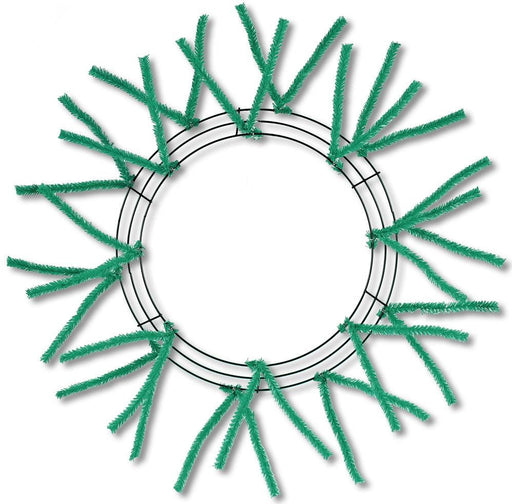 The 24 Pencil Wreath Emerald Green Non-Metallic XX750406 has textured emerald green stems resembling tinsel, arranged circularly and extending outward, all set against a plain white background.