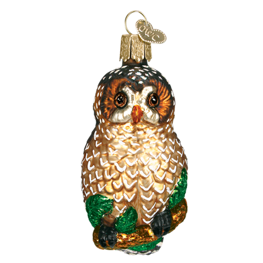 The Spotted Owl Old World Christmas Ornament 16052 showcases a glass owl adorned with intricate brown and white feathers, delicately perched on a branch with green leaves. Featuring detailed eyes and a small metal loop for hanging, it subtly raises environmental awareness about endangered species.