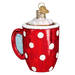 The Hot Cocoa Old World Christmas Ornament 32310 is a mouth-blown glass piece, shaped like a hot cocoa mug with white polka dots on red, topped with whipped cream and a gold attachment, perfect for holiday cheer.