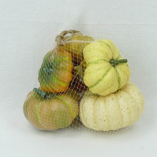 A mesh bag contains a small assortment of 5 decorative pumpkins (52475ASST), featuring various colors such as white and green-striped, set against a plain white background.