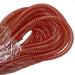 A coiled, shiny Deco Flex Tubing Burgundy with 18K Gold Metallic Foil featuring a braided pattern and textured surface, partially wrapped in clear plastic on one end, set against a plain white background.
