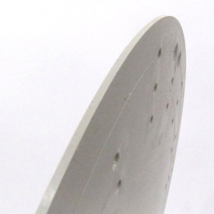A close-up of the edge of the 15.5 Plastic Character Wreath Form, featuring small holes on a smooth, matte gray surface akin to Unique in the Creek designs, against a plain white background.