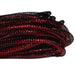 A bundle of coiled, shimmering black and Antique Red Foil Deco Flex Tubing rests on a white background. The mesh tubing has a textured surface with a glossy appearance.