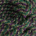 Close-up of Gold Purple Emerald Tinsel Flex Tubing Mardi Gras RE3543J4, showing overlapping coils in festive green, gold, and purple metallic colors for a vibrant textured look.