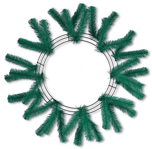 The Work Wreath 24" Emerald Green XX748806 features sparsely attached, evenly spaced artificial pine branches on a 24-inch frame, shown against a white background.